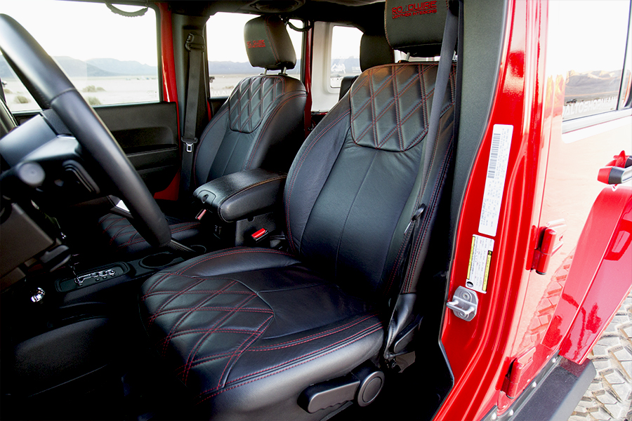 Custom interior seats are black with red stitiching.