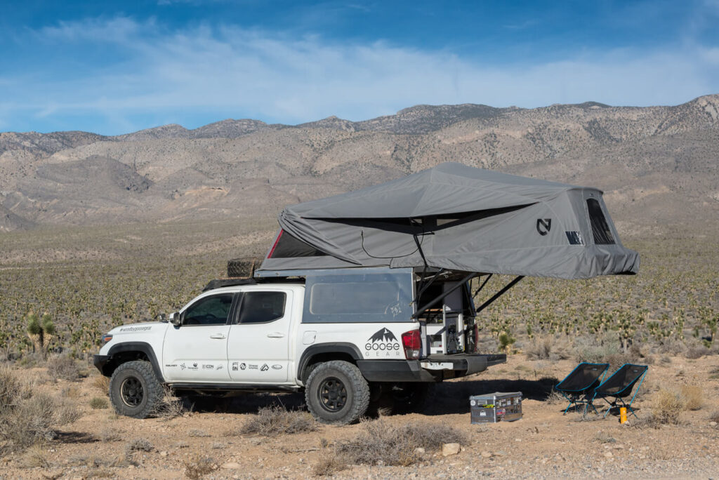 A full living-quarters system designed specifically to work on a Toyota Tacoma outfitted with an AT Overland Habitat bed-mounted shell.