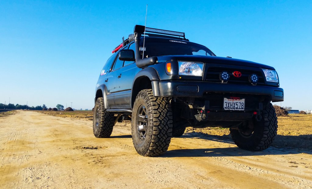 modified Toyota on a dirt road. 