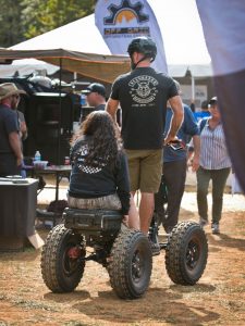 2019 Overland Expo East: Man and woman ride 4-wheeled off-road scooter