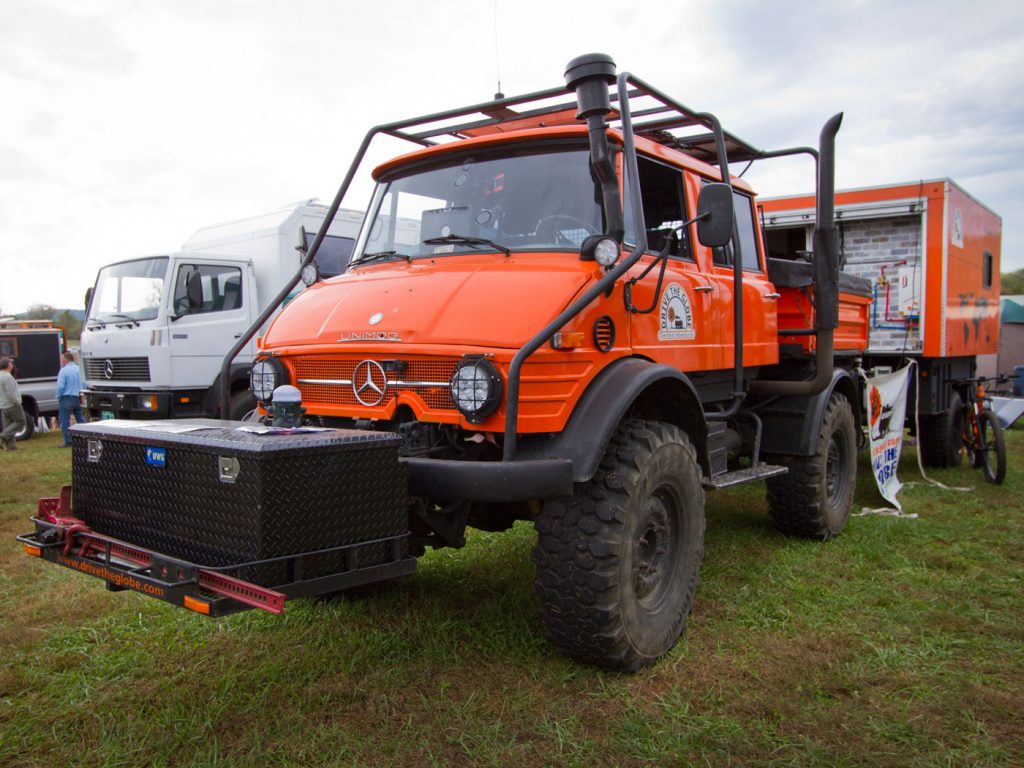 2019 Overland Expo East: 1979 four-door Unimog with home-built trailer using a Schutt Industries M1102 military trailer base and living quarters on top.