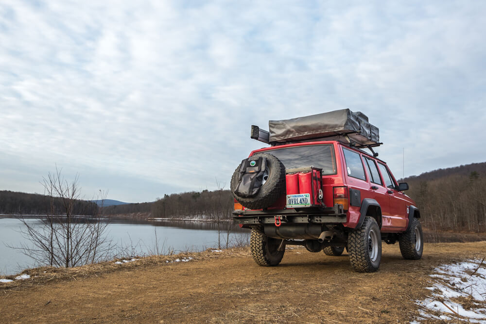 The rear bumper is custom made with swing out and lockable double jerrycan holder