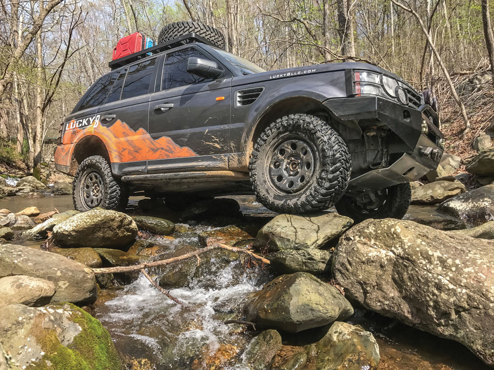 Lucky 8 Off-Road Range Rover Sport driving over rocks