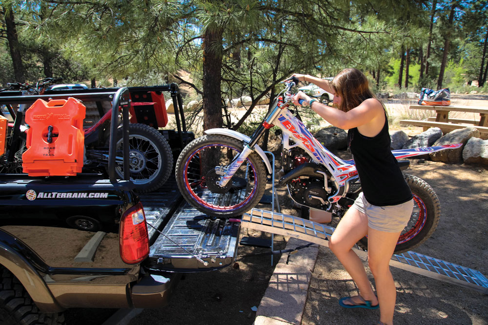 Loading a trials motorcycle into a truck with a bed rack