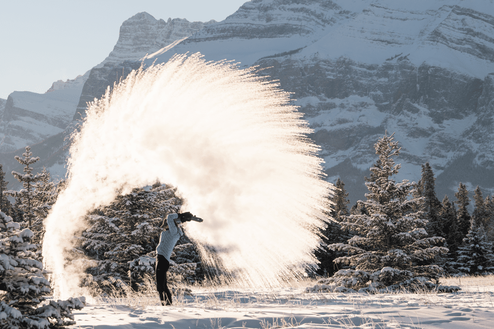 Lisa Morris tosses snow in Alberta, Canada