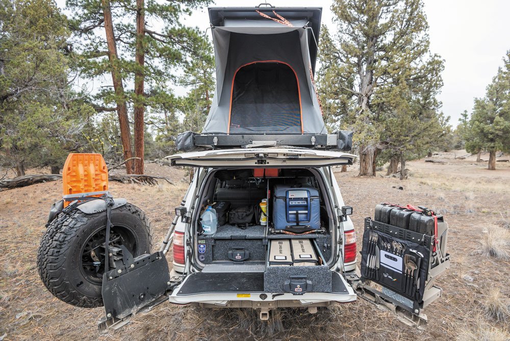 Lexus LX470 camping setup shown with drawer system and refrigerator.