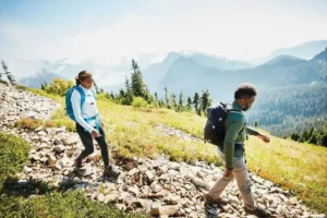Man and woman walking downhill