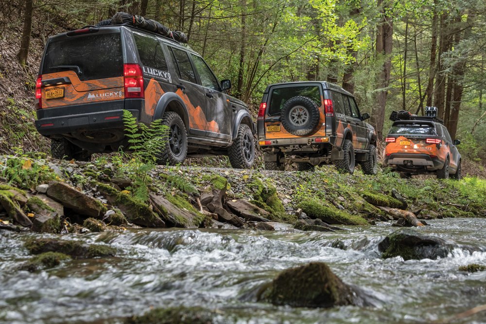 Land Rover Discoveries driving