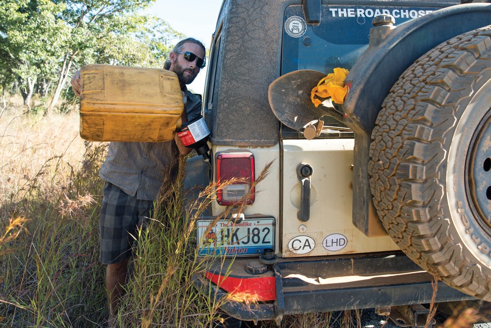 Filling the Jeep with gas using a jerrican