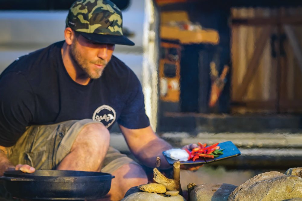 Adventure Chef Adam Glick cooking on the trail