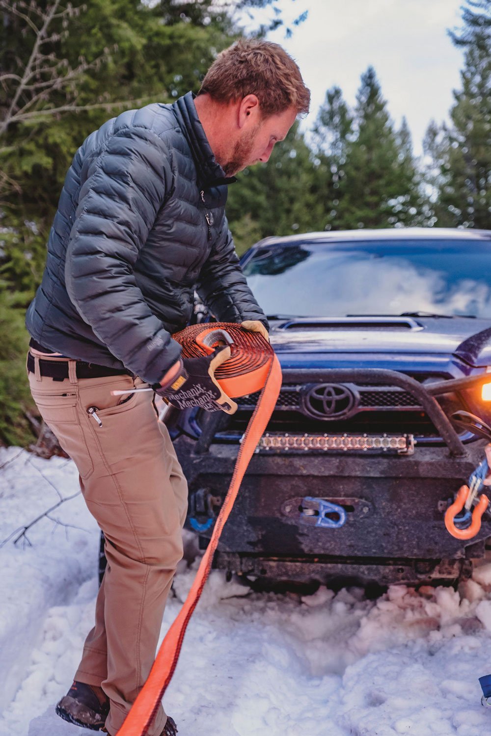 man using recovery gear in snow