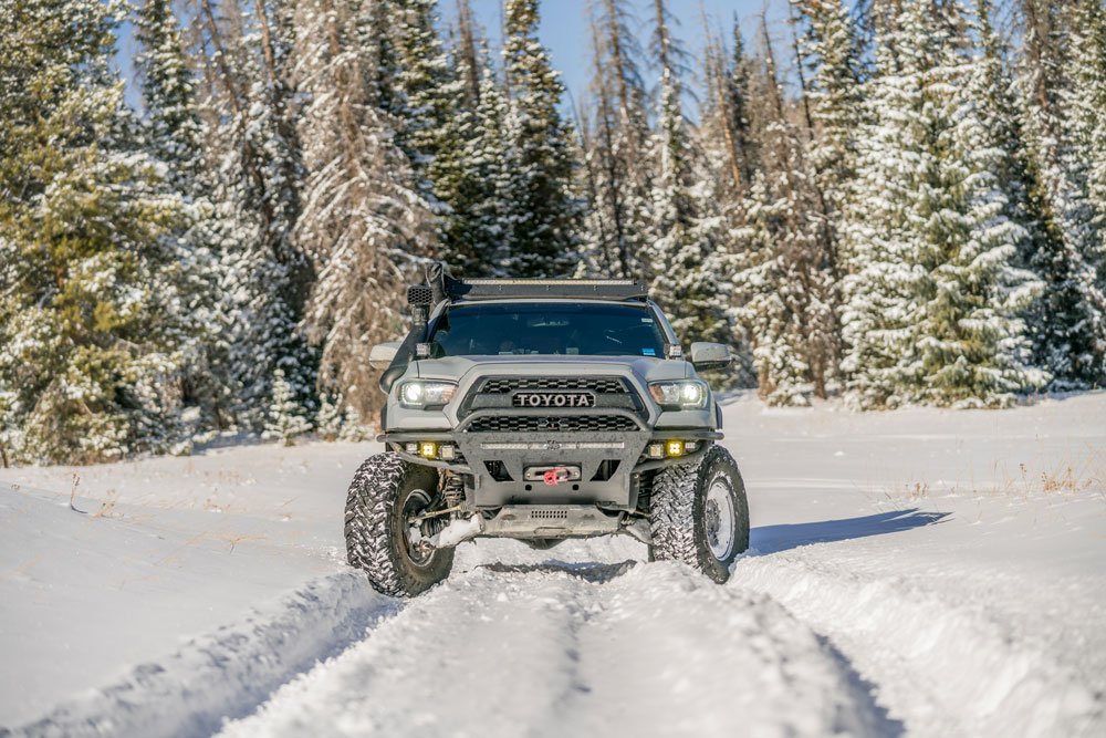 Front view of snow-wheeling Tacoma