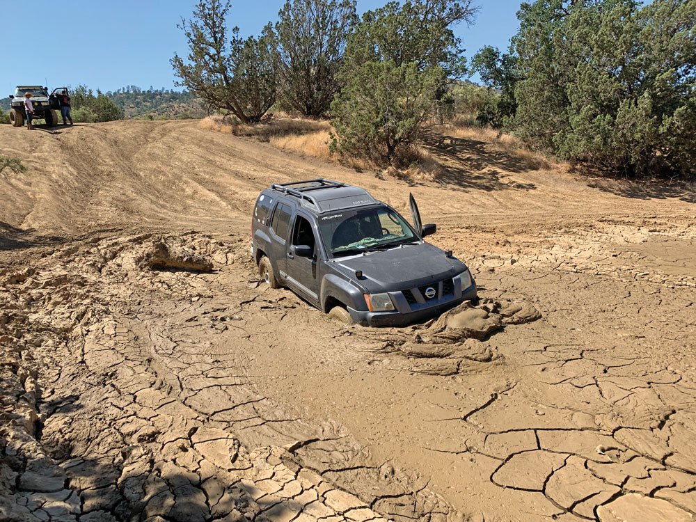 Nissan stuck on the trail