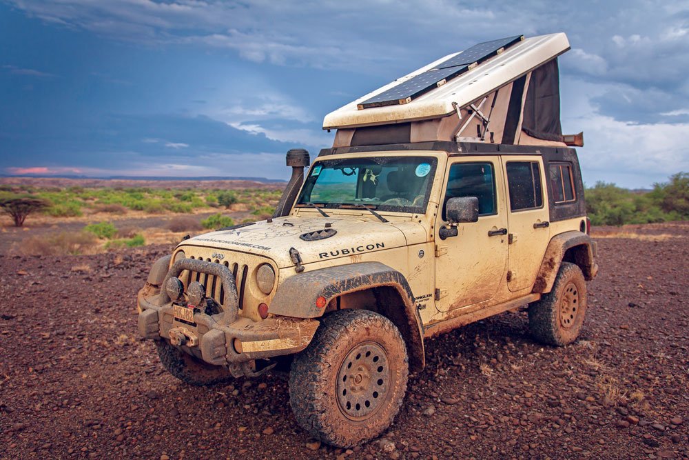 Messy Jeep traveling muddy tracks in Kenya