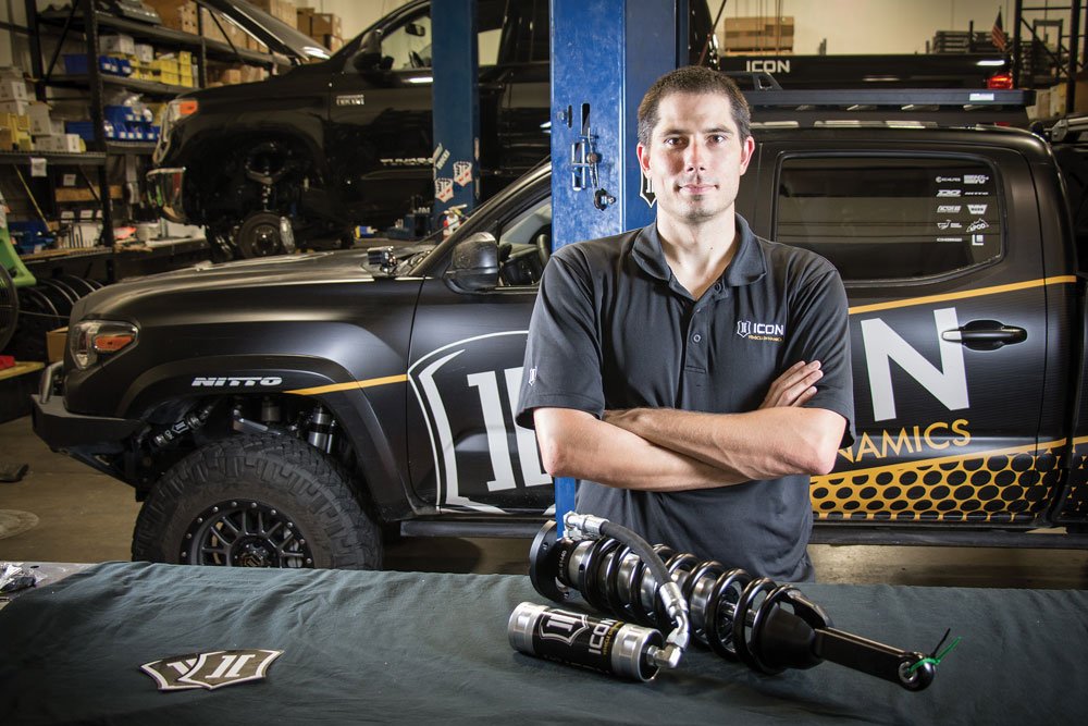 Employee with an ICON Vehicle Dynamics spring