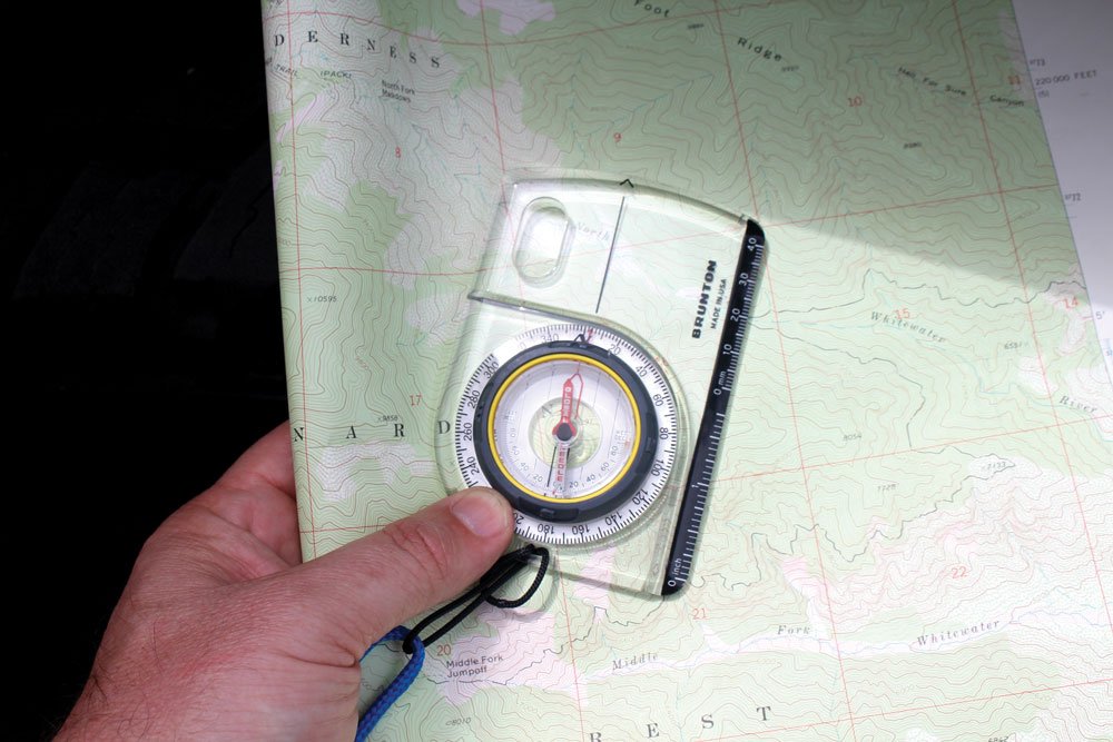 Orienting a compass to a map