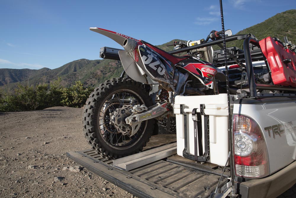 Tacoma truck bed hauling a motorcycle