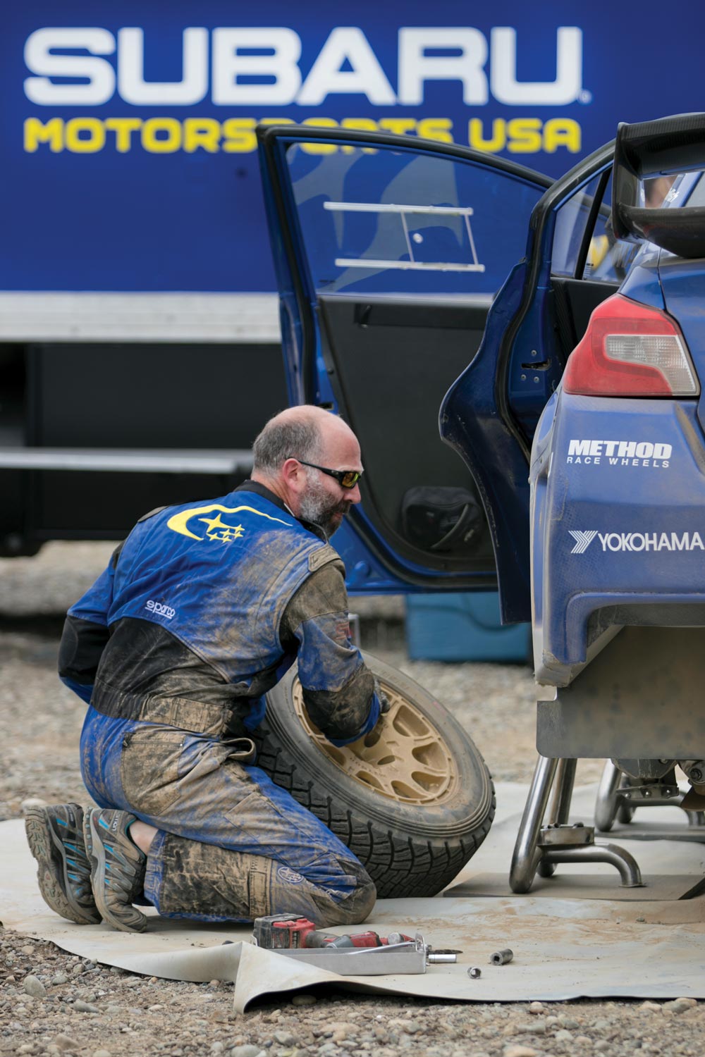 Subaru's Graham Price working on Higgins' car