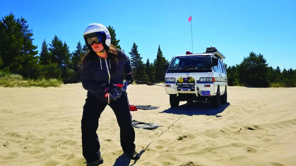 Women pulling winch cable 