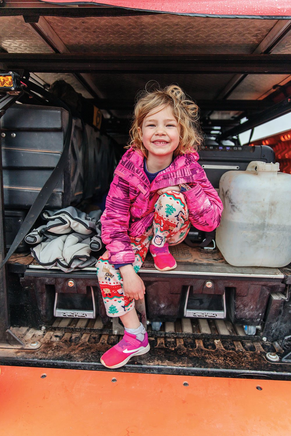 Hoglund's daughter sits in the back of the Tacoma TRD