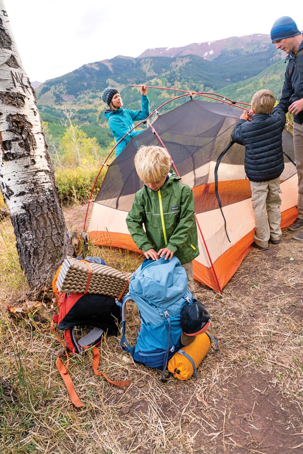 Putting the camping tent together as family