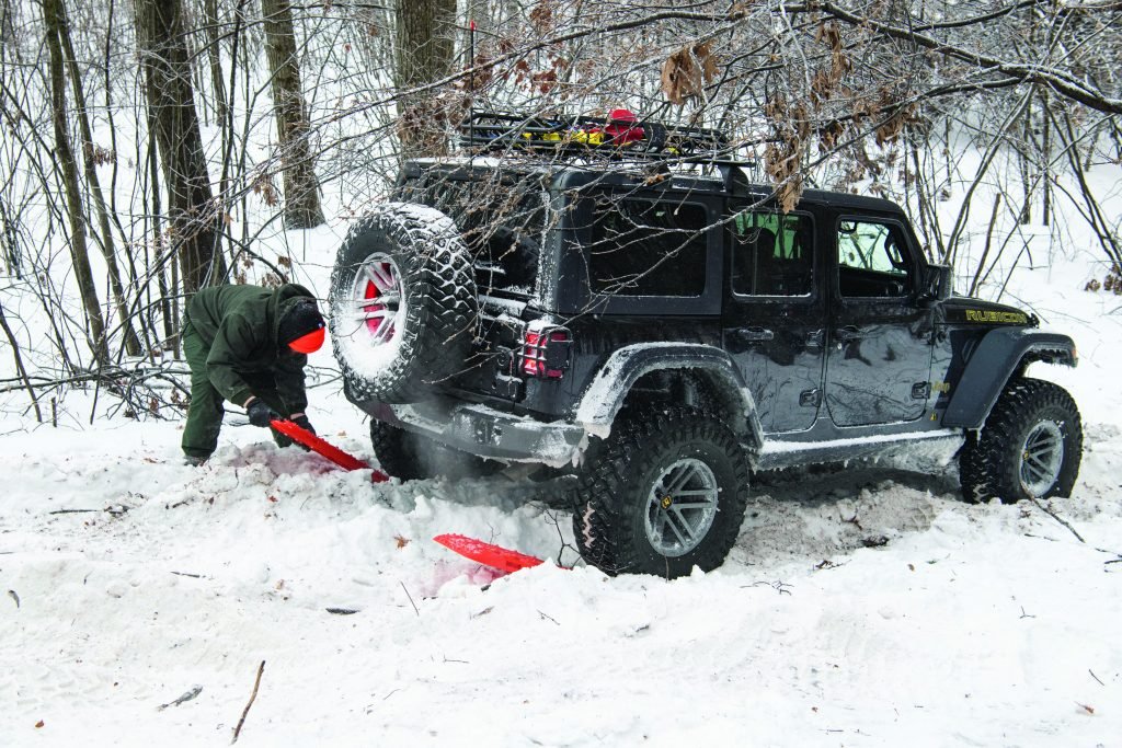 Using recovery boards to get the vehicle out of the snow