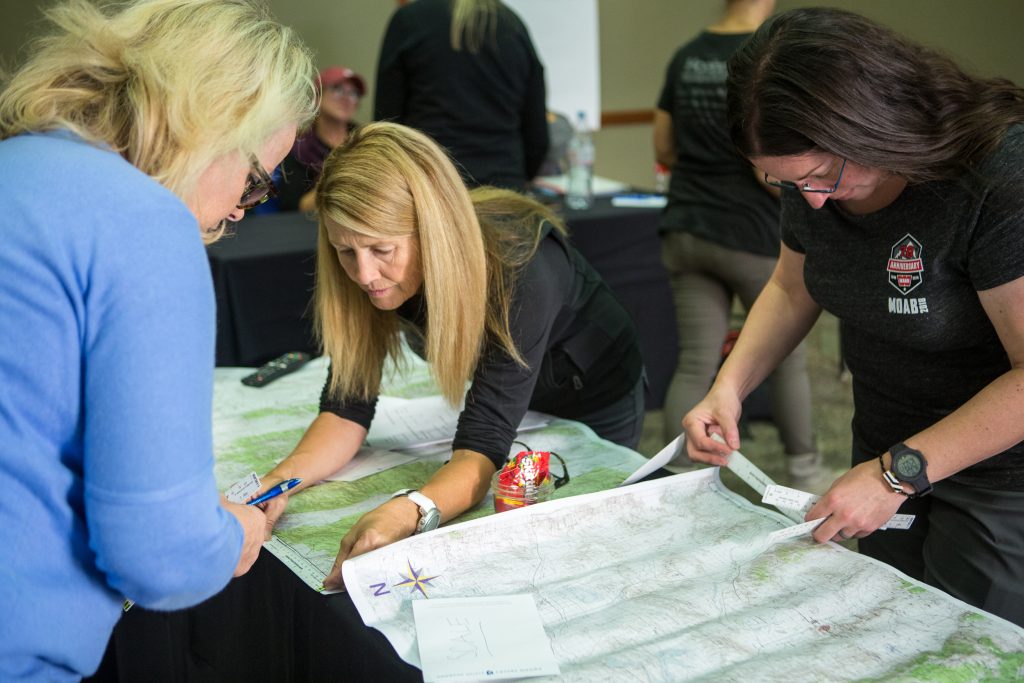 Emily Miller planning her course using a map