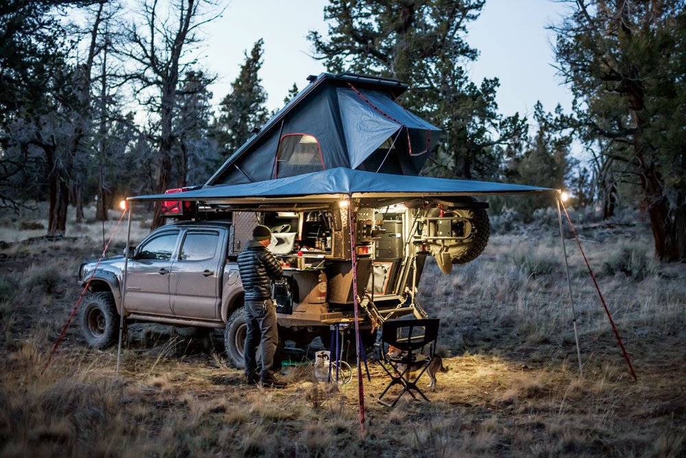 Enjoying a hot meal under the Tacoma and Khaya Camper