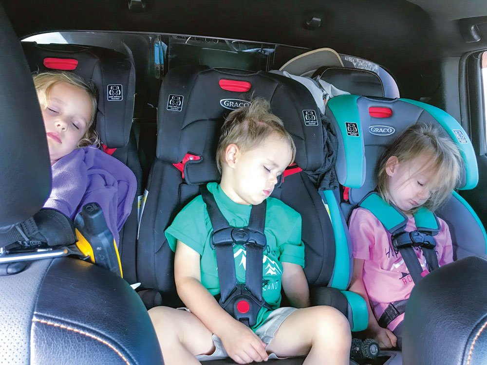 Travel with kids tip: Three car seats easily fit in the back of an SUV