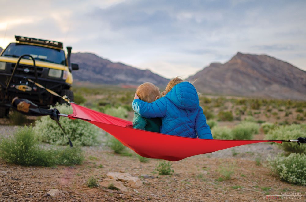 Two kids on a hammock at the campground