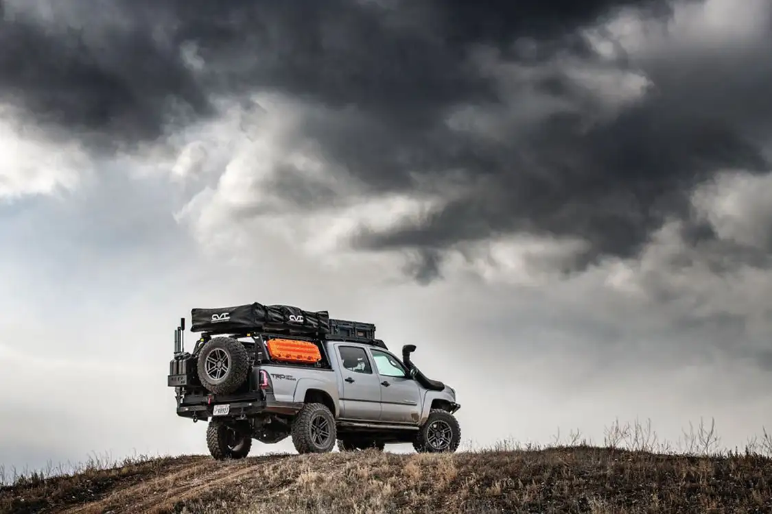 Tacoma TRD exploring under dark clouds