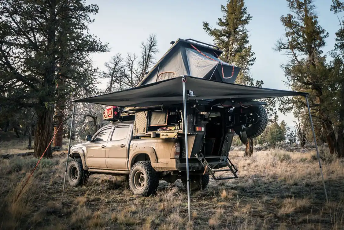 Tacoma and Khaya Camper set up for camp