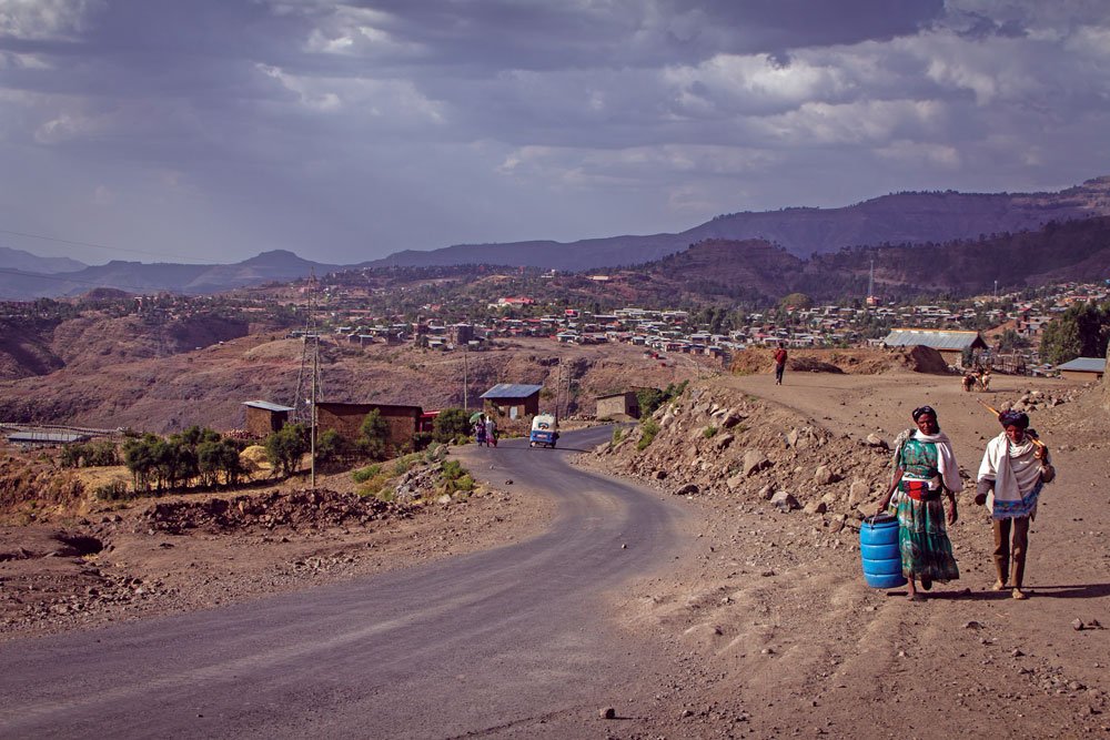 Villagers in Ethiopia are seen carrying containers to get water