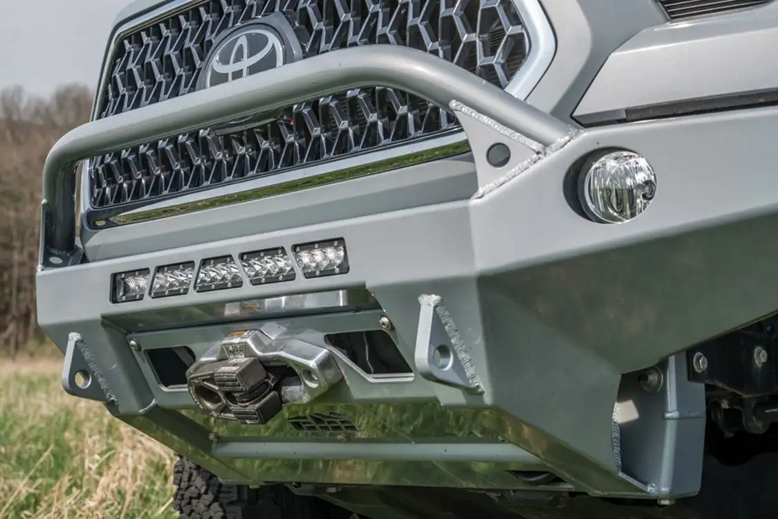 CBI front bumper, recovery points, light mounts, and a Warn winch mount