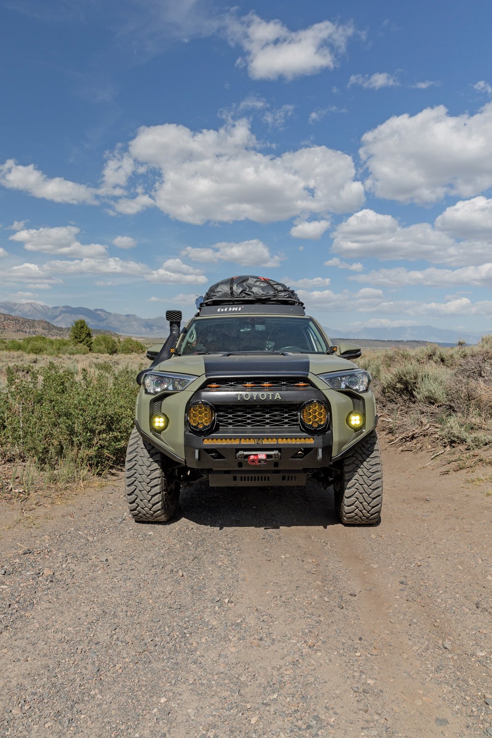 This 4Runner has a khaki green satin wrap and black hood stripe