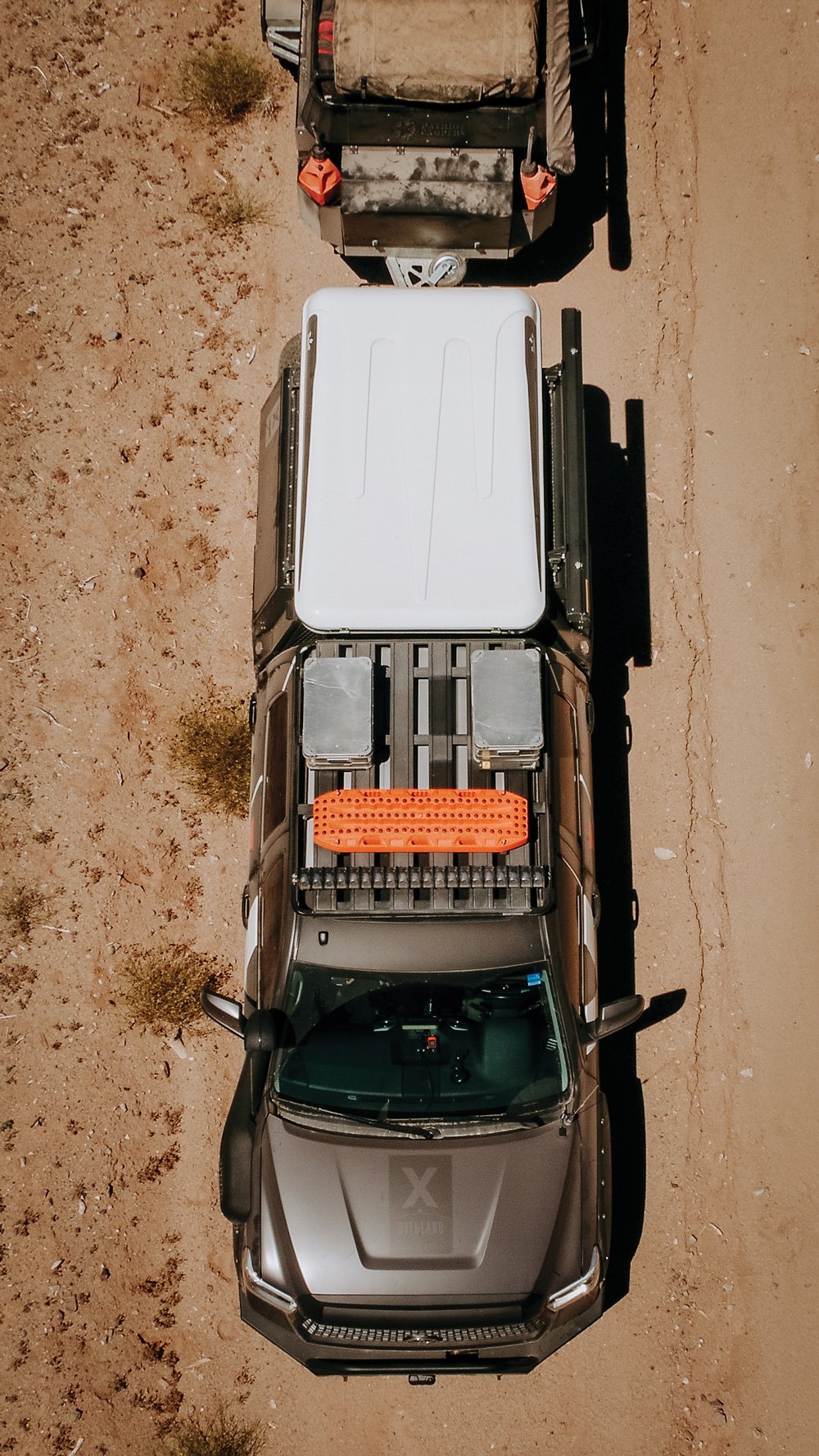 A full set of Maxtrax, two Aluboxes, and an Eezi Awn Dart RTT are mounted on the roof