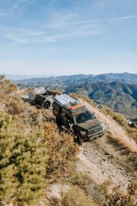 A gray Toyota Tundra belonging to Citizen J podcast guest XOverland tackles sandy trail.