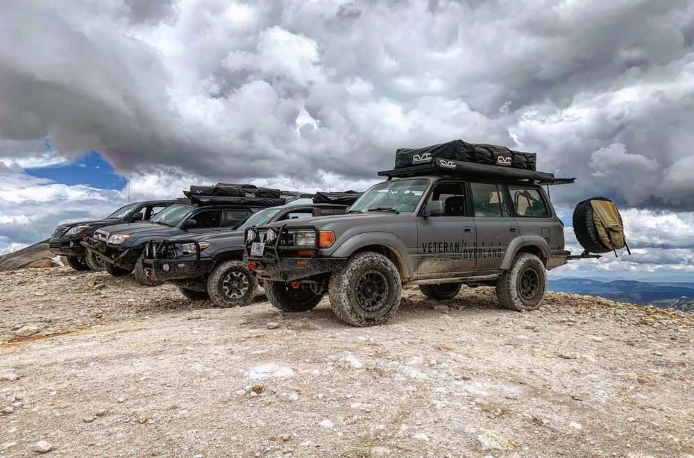 Vehicles all lined up with Veteran Overland for recreational activities