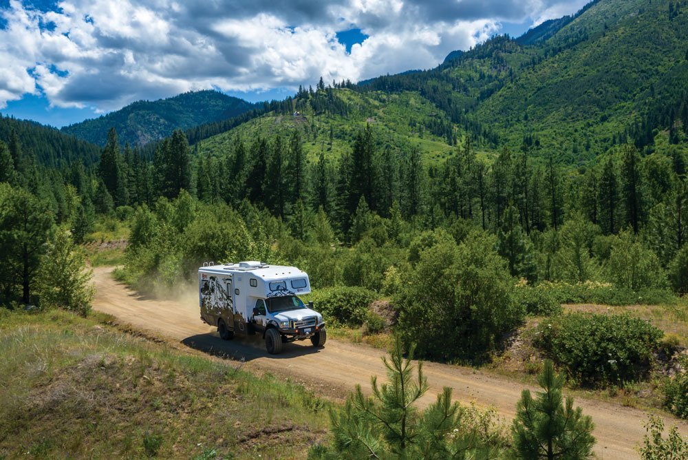 Nitro Gear Ultimate Adventure RV driving along a remote road