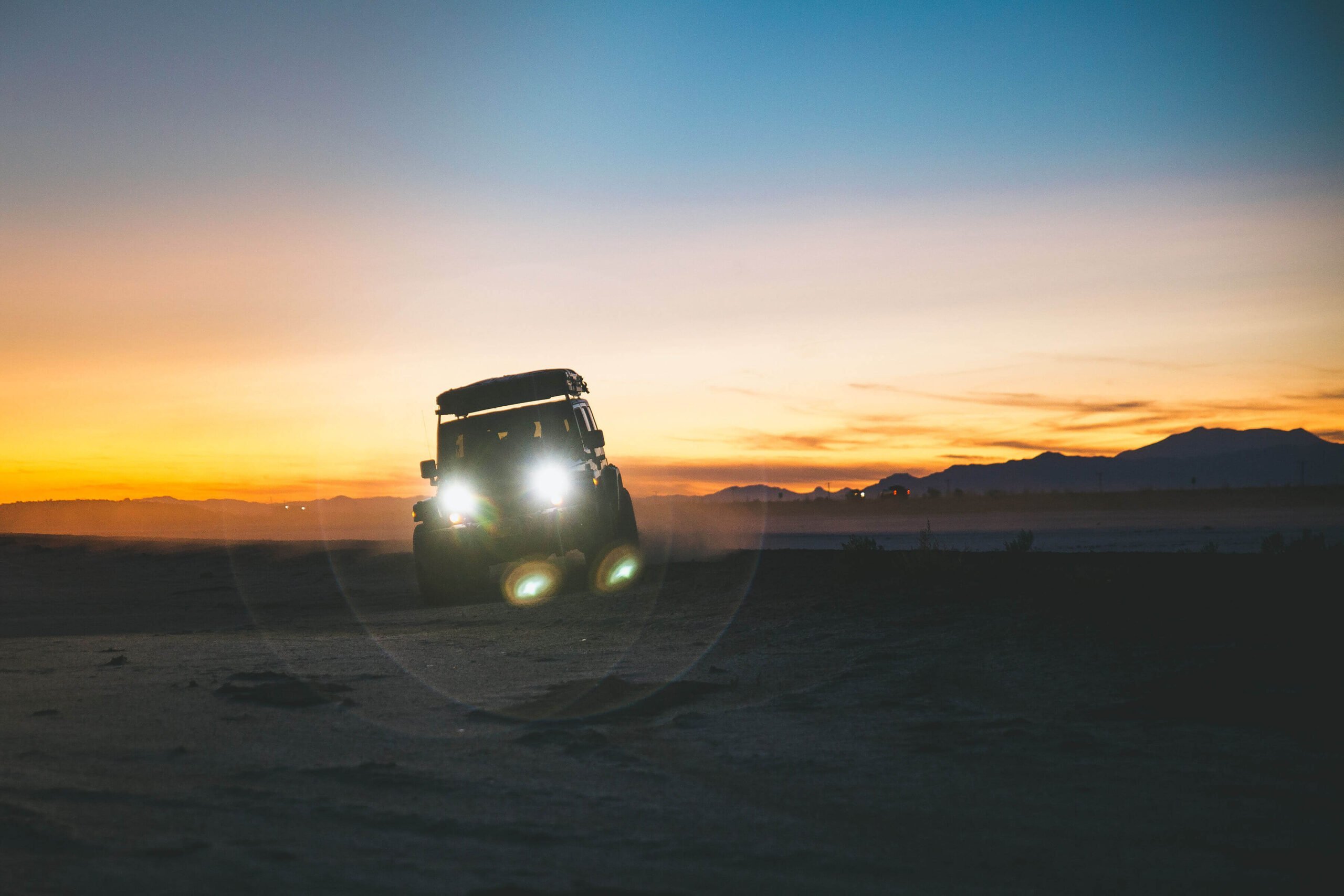 Jeep during sunset in desert