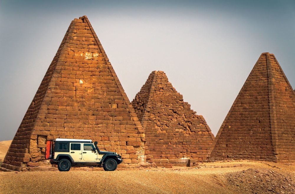 Adventure writer Dan Grec's jeep in front of a temple in Sudan