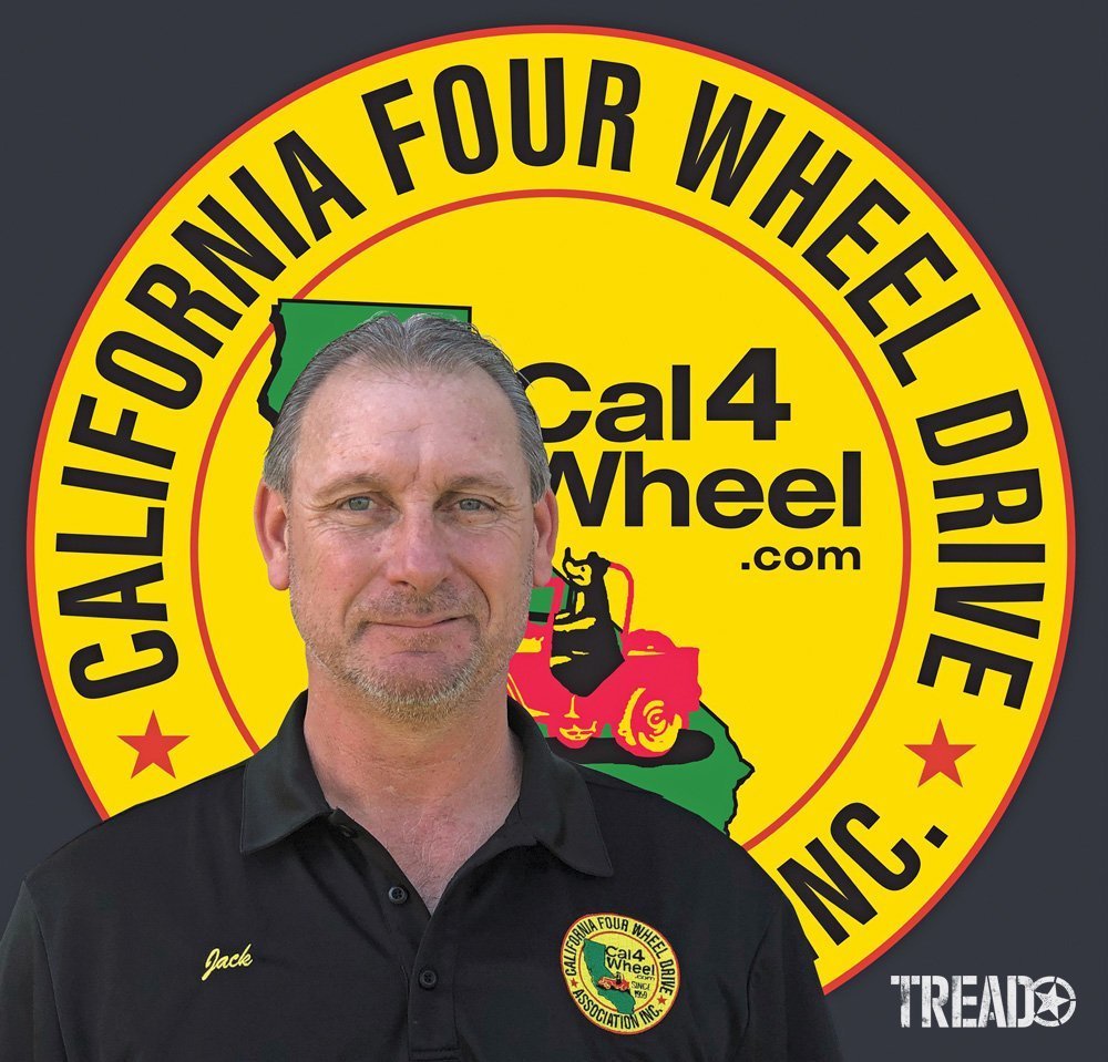 Photo of Jack Chapman, President of the California Four Wheel Drive Association (CA4WDA), with their logo behind him