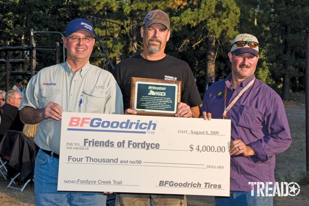 Men holding up a BFGoodrich check for Friends of Fordyce