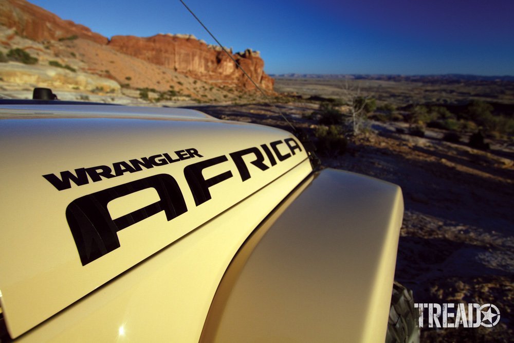 Jeep Wrangler hoot shot against rocky landscape