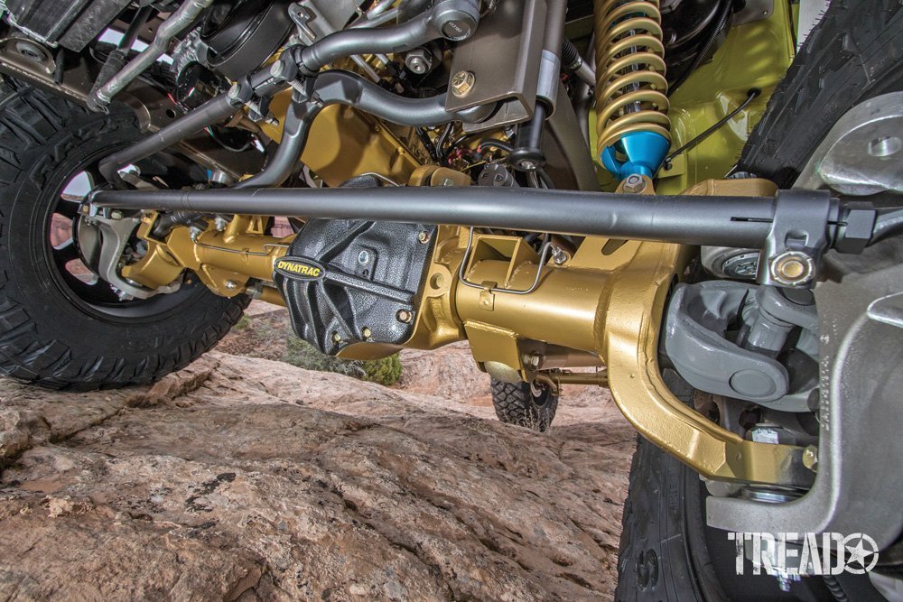 Image of undercarriage of a vehicle with gold axle.