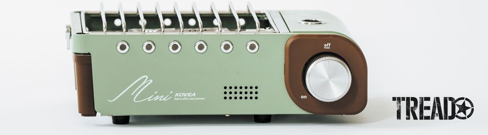 The KOVEA All-in-One Mini Stove has a mint green body with dark brown and chrome accents, it is retro looking.