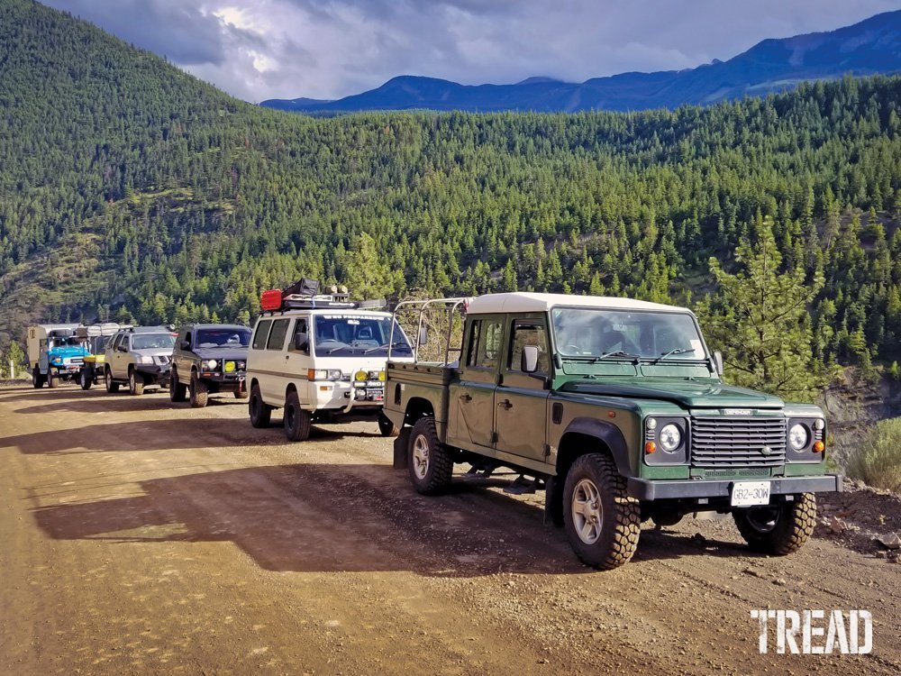 Land Rover Defender 130, Mitsubishi Delica and Pajero, a Nissan Xterra, and a Toyota FJ40