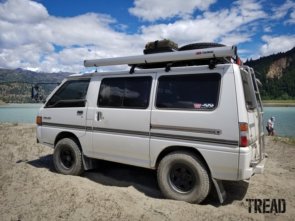 Mitsubishi Delica 4x4 van next to lake