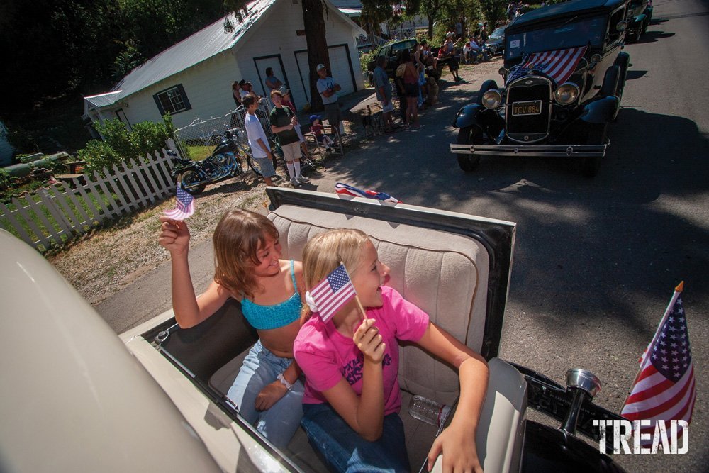 Two girls in a Fourth of July parade.