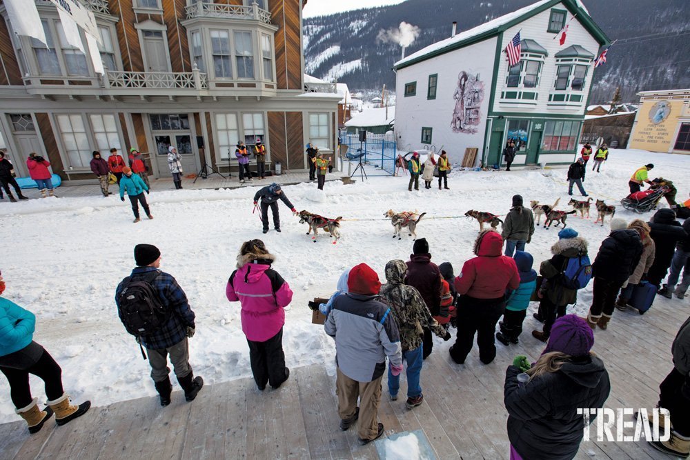 A dogsled team leaves the starting line at the Percy DeWolfe dogsled race.